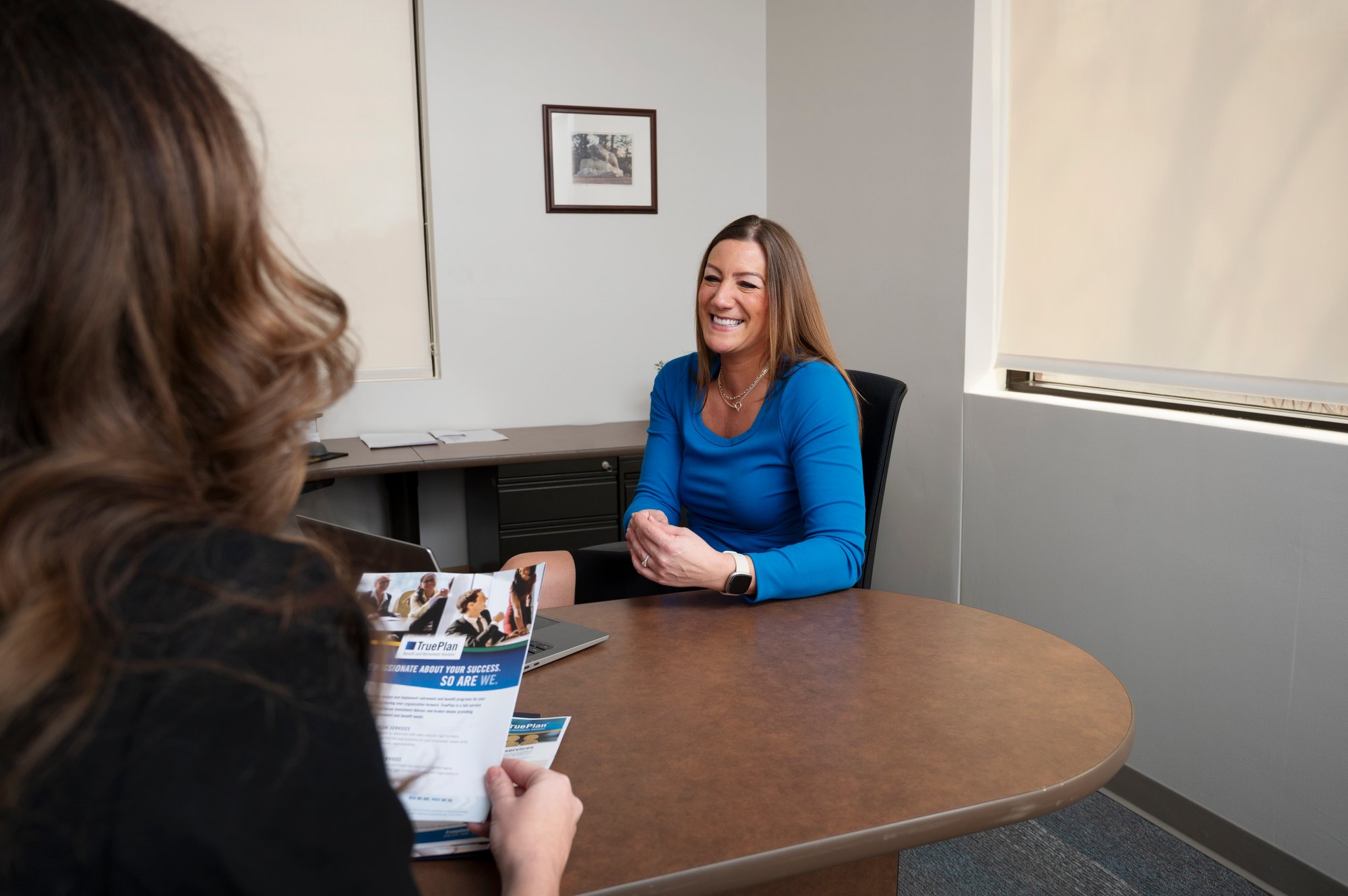 TruePlan's Kylee Hall explaining employer-sponsored plans to client